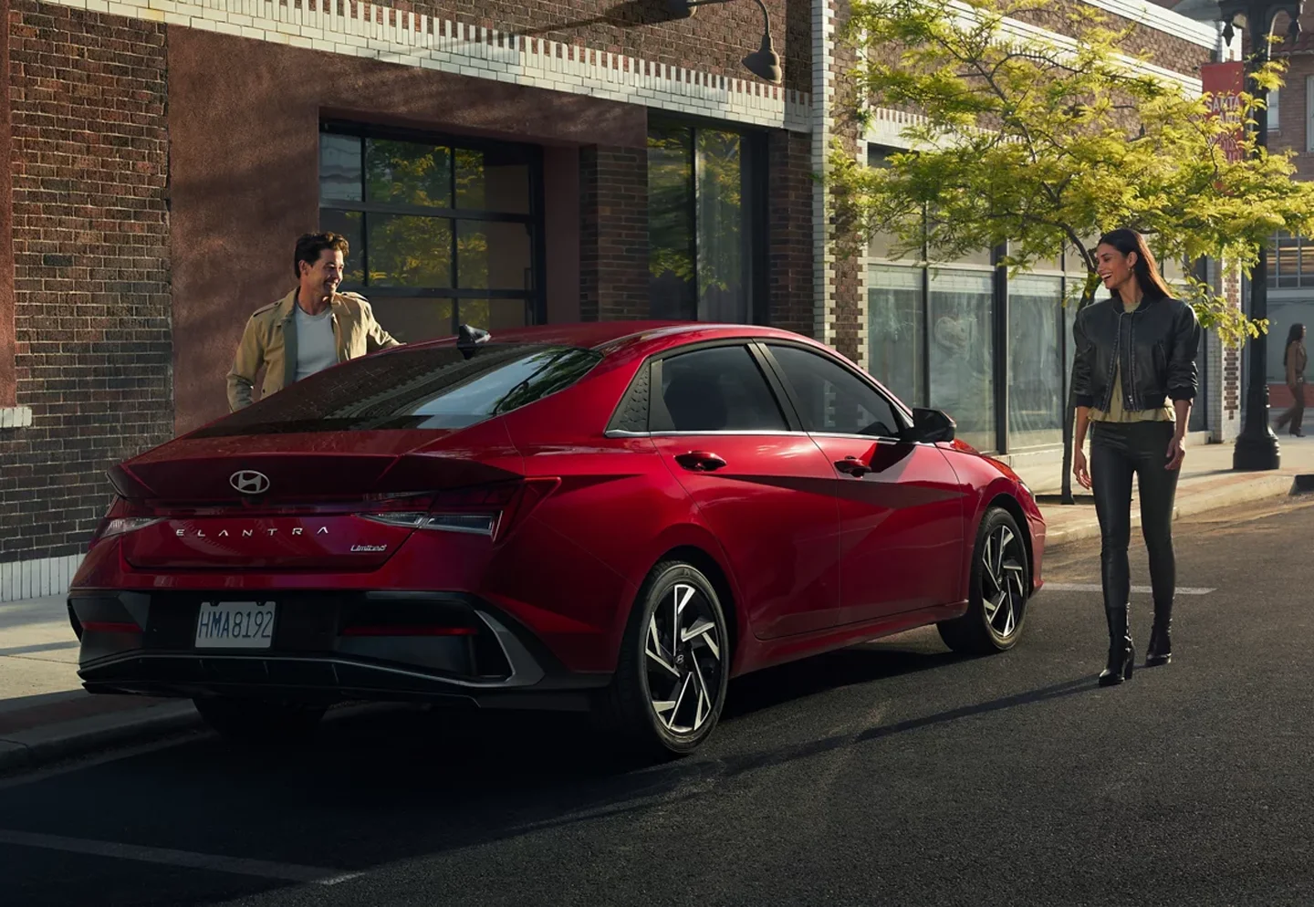 Woman and Man Walking up to 2024 Hyundai
