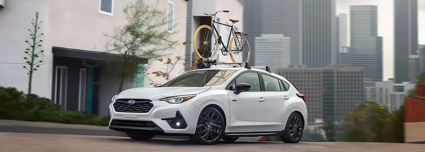 Personalized Financing Solutions Subaru Driving Over City Hill