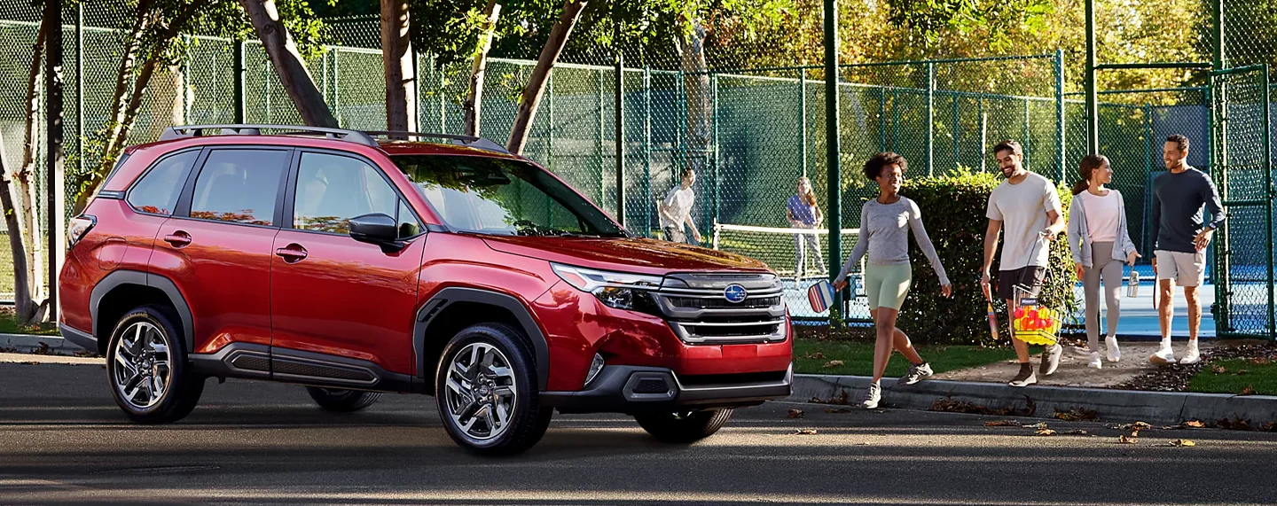 Subaru parked Next To Tennis Court