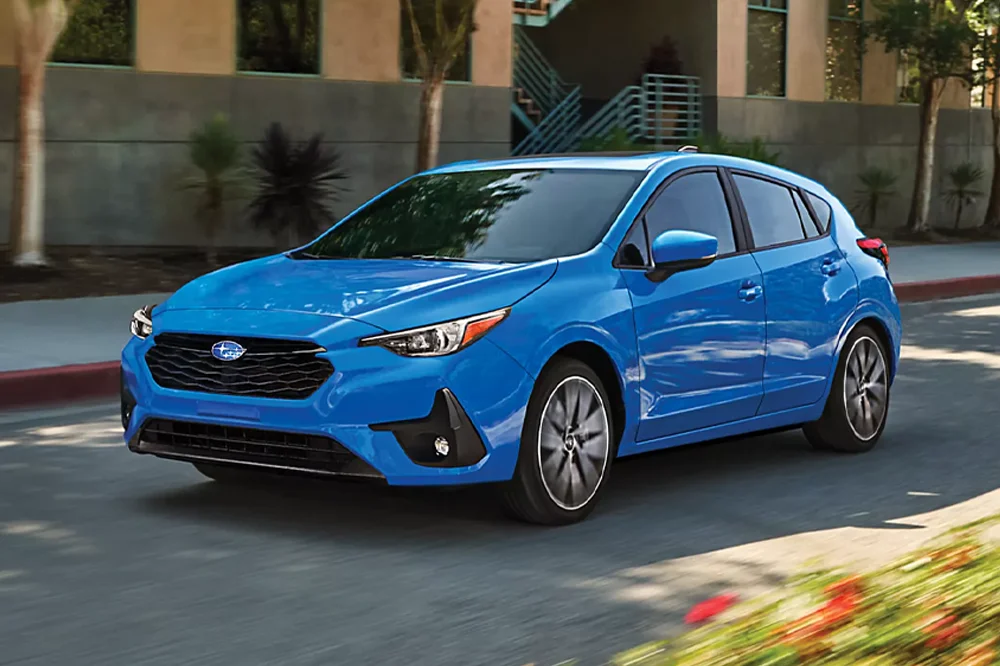 Subaru driving down road