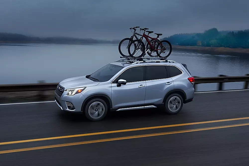 Subaru Driving past lake