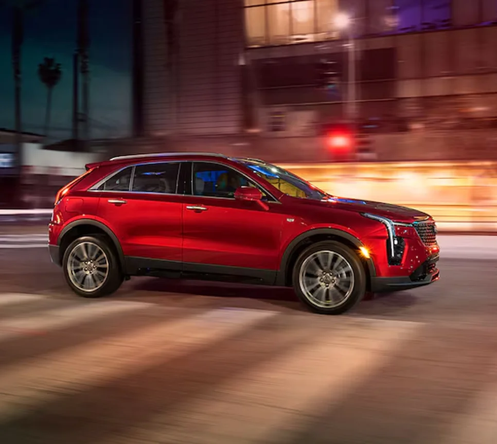 Cadillac XT4 Driving Down Street at Night