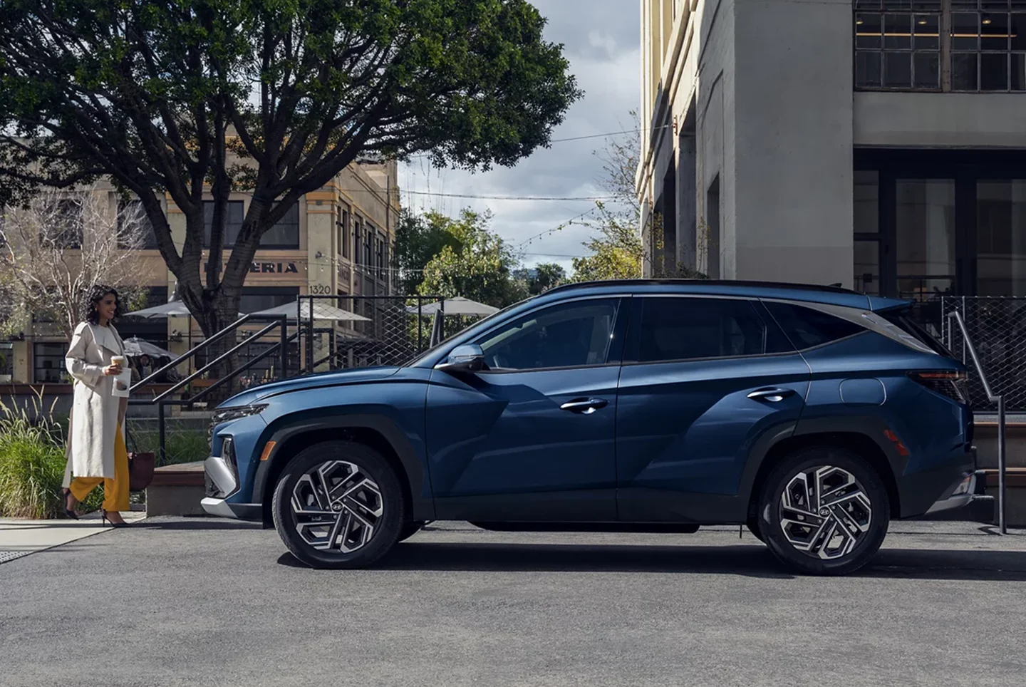 Woman walking up to 2024 Hyundai