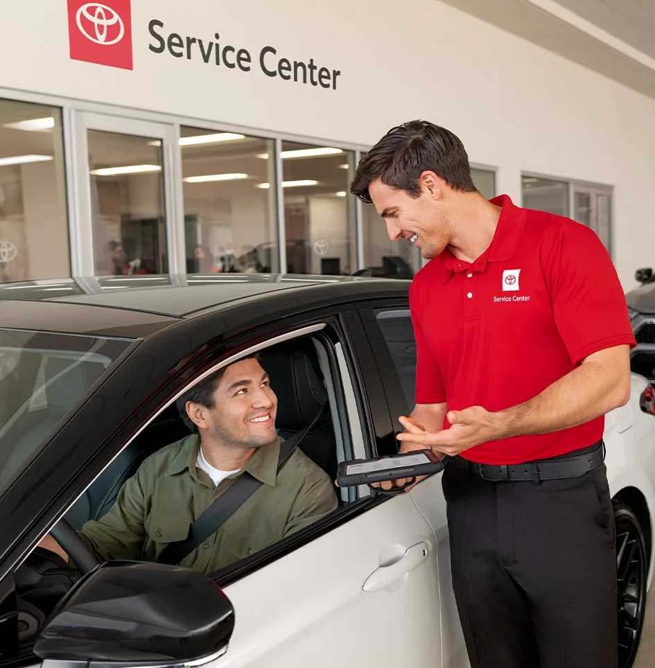 Toyota service technician with a customer