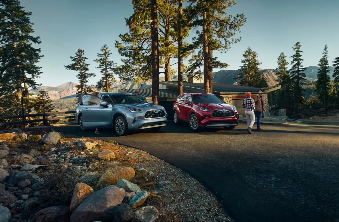 Toyota Highlanders parked near trees