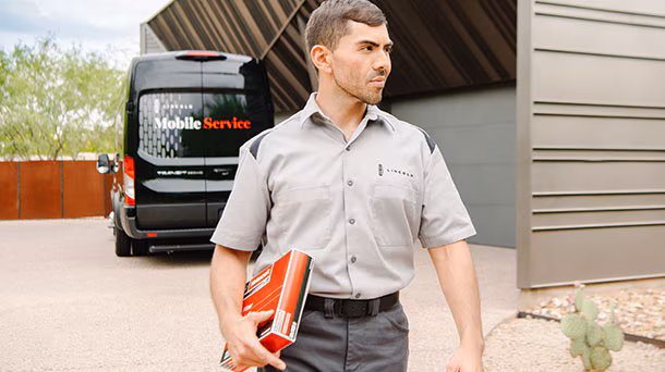 Lincoln mechanic Walking with part