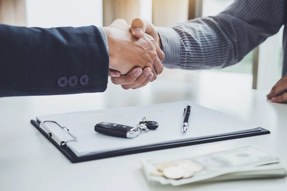 Shaking Hands over Car Sale