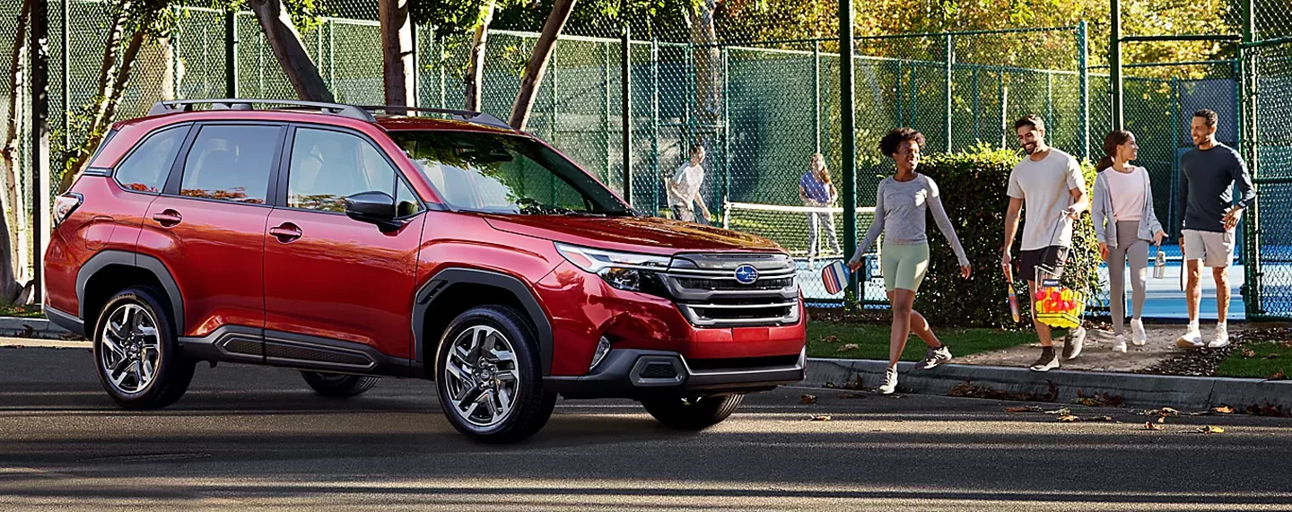 Subaru Forester parked near a tennis court