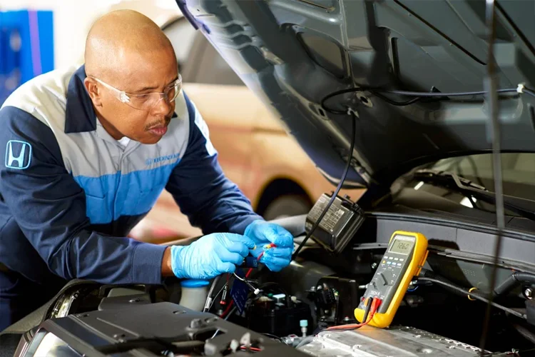 Honda Tech working on car