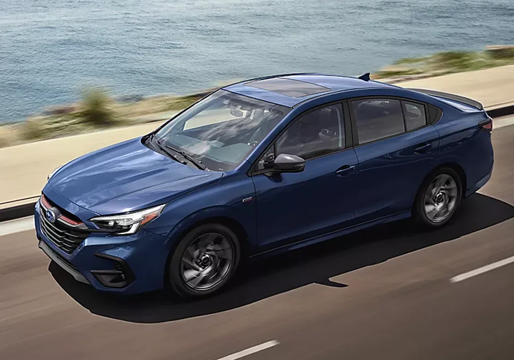 Subaru Legacy driving down the street